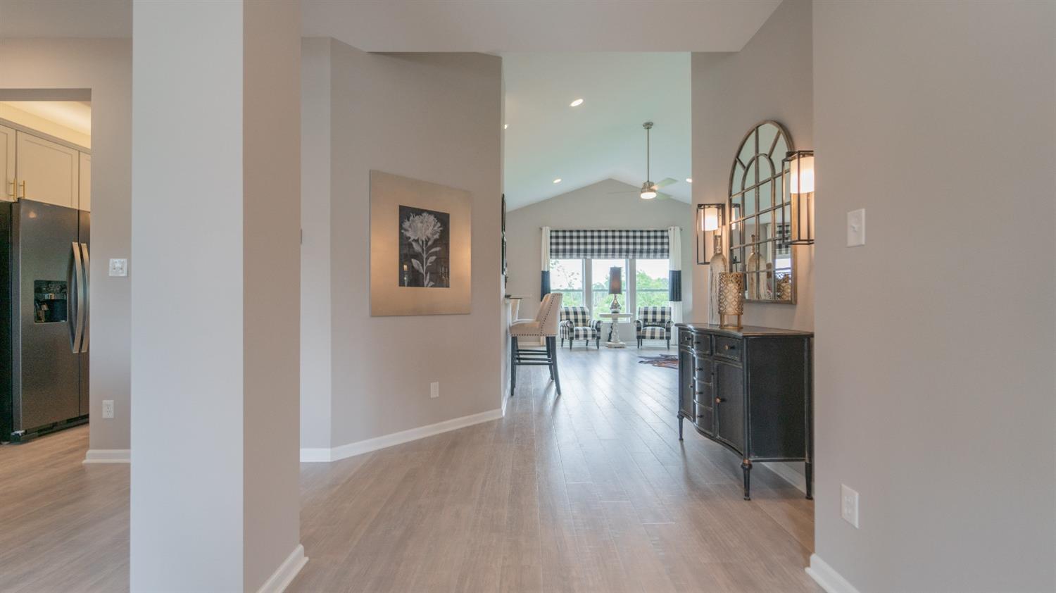 8713 Burr Rdg Circle Crown Point, IN 46307 - Photo 10 of 21 wooden floor in a hall with a dining table & chairs in a room