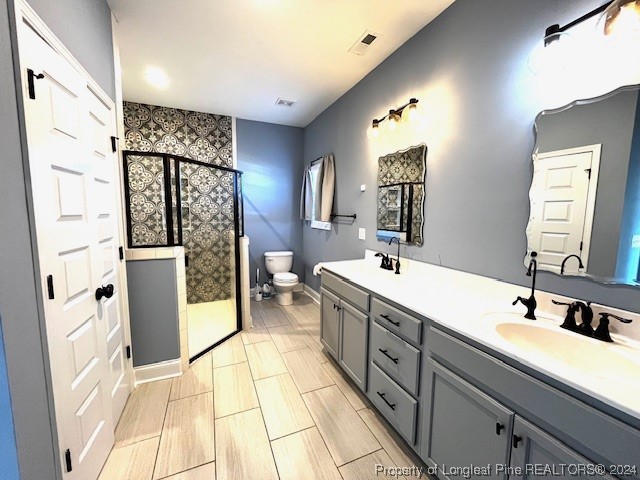 4437 Dudley Road Fayetteville, NC 28312 - Photo 12 of 41 a spacious bathroom with a double vanity sink and a mirror