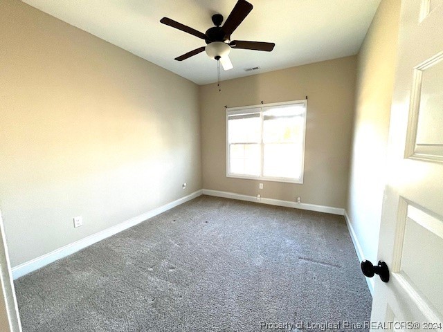 4437 Dudley Road Fayetteville, NC 28312 - Photo 19 of 41 a view of a livingroom with a ceiling fan and window