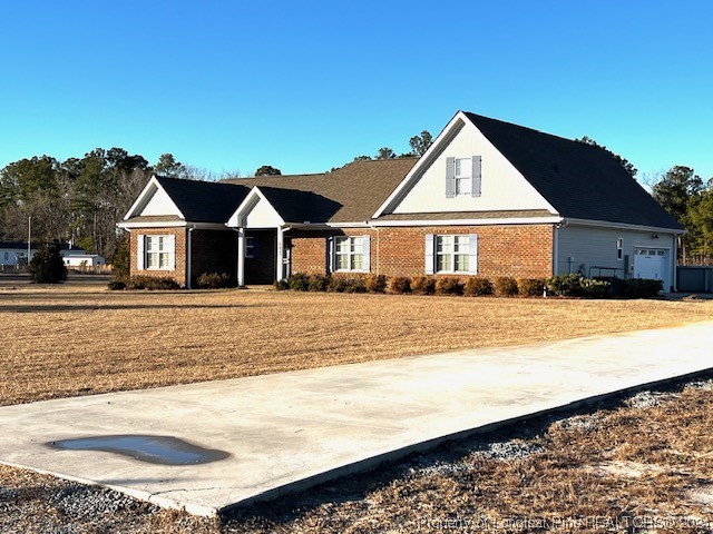 4437 Dudley Road Fayetteville, NC 28312 - Photo 3 of 41 a front view of a house with a yard