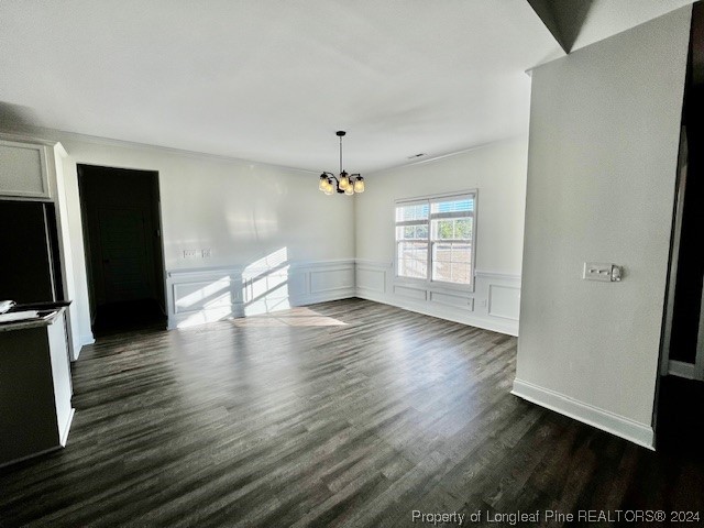 4437 Dudley Road Fayetteville, NC 28312 - Photo 6 of 41 an empty room with wooden floor and windows