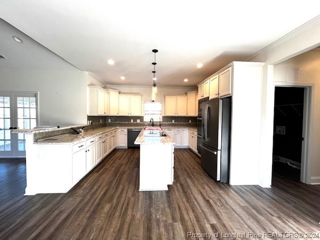 4437 Dudley Road Fayetteville, NC 28312 - Photo 7 of 41 a kitchen with a refrigerator and a stove