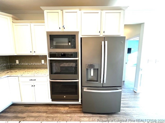4437 Dudley Road Fayetteville, NC 28312 - Photo 8 of 41 a kitchen with stainless steel appliances granite countertop a refrigerator and a stove