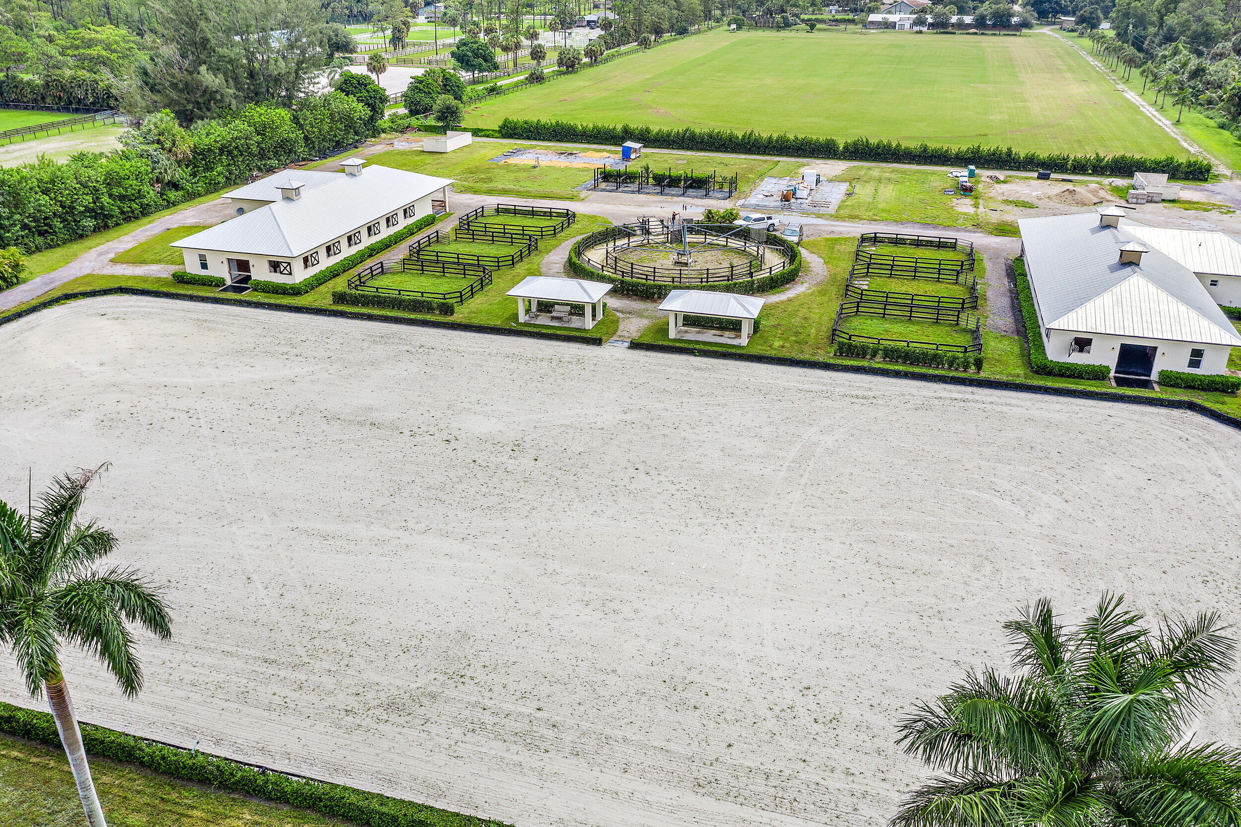 1150 F Road Loxahatchee Groves, FL 33470 - Photo 11 of 33 an aerial view of a house with a yard and lake