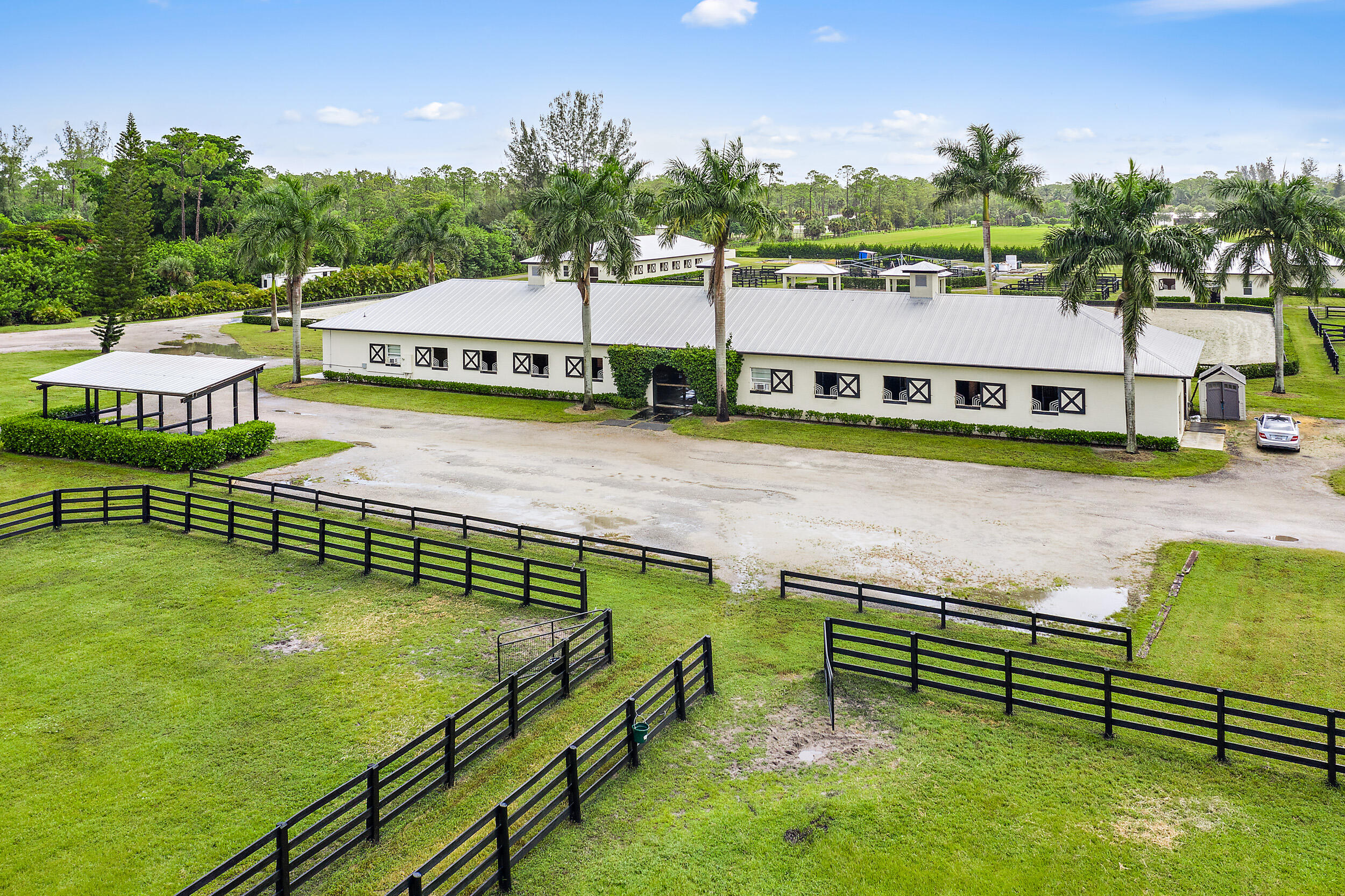 1150 F Road Loxahatchee Groves, FL 33470 - Photo 14 of 33 a view of a lake with houses on th terrace
