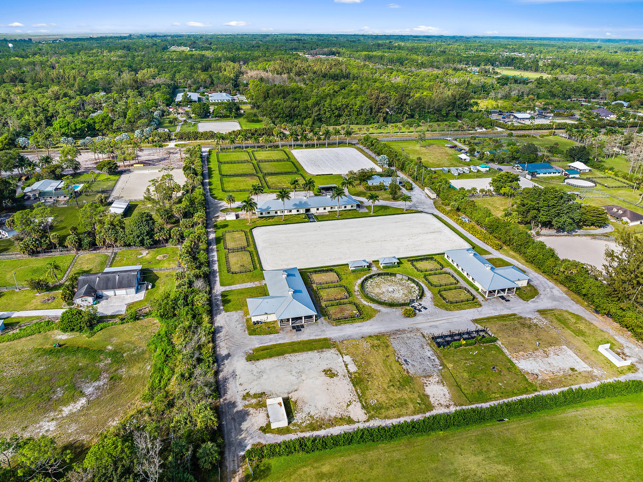 1150 F Road Loxahatchee Groves, FL 33470 - Photo 17 of 33 an aerial view of residential houses with outdoor space