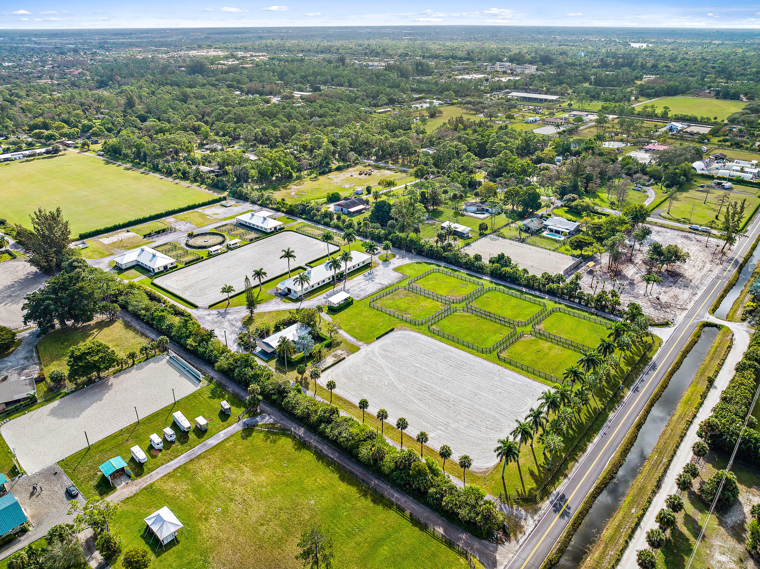 1150 F Road Loxahatchee Groves, FL 33470 - Photo 20 of 33 an aerial view of a pool yard and mountain view in back