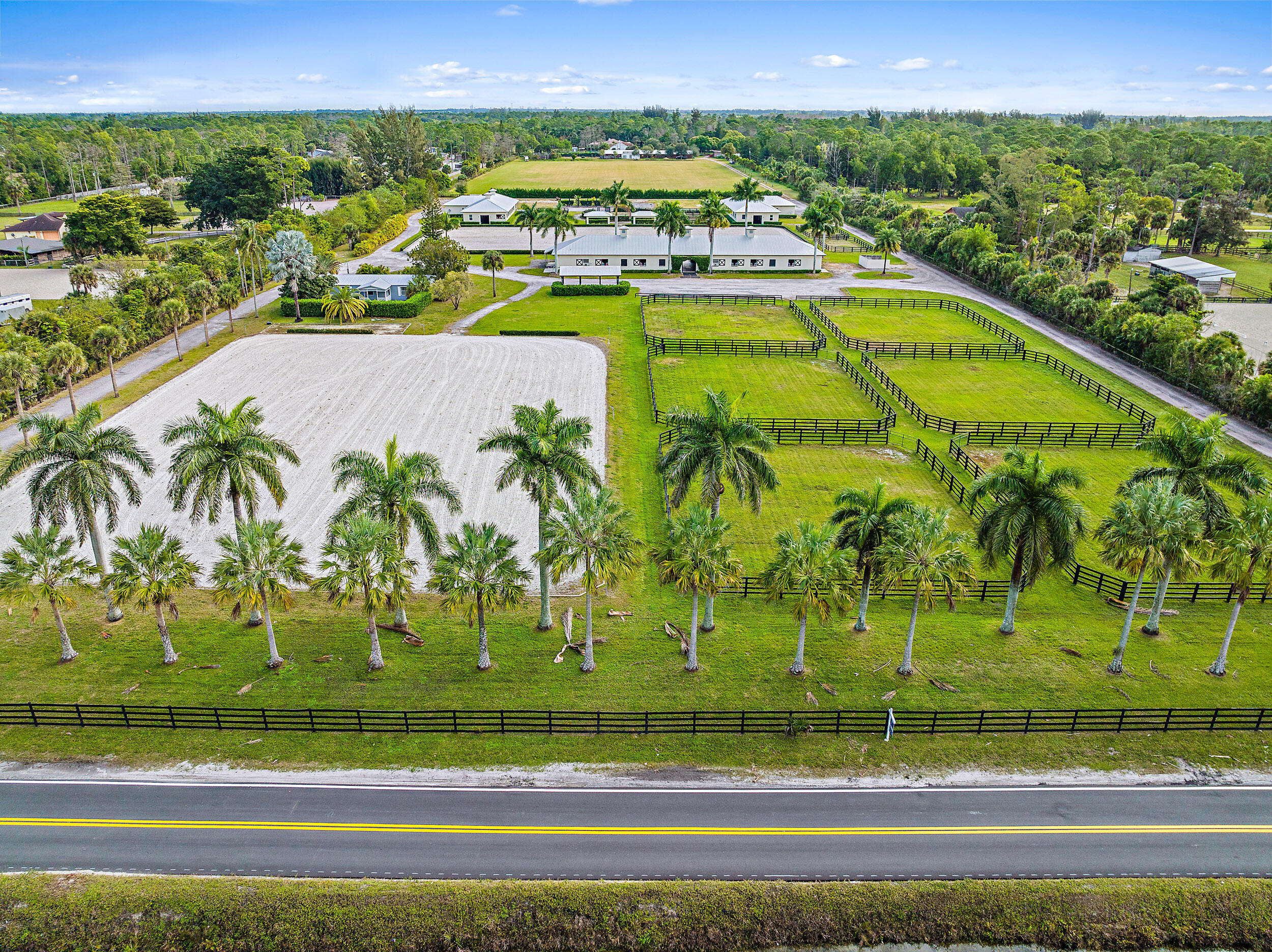 1150 F Road Loxahatchee Groves, FL 33470 - Photo 25 of 33 a view of swimming pool with a garden and seating area