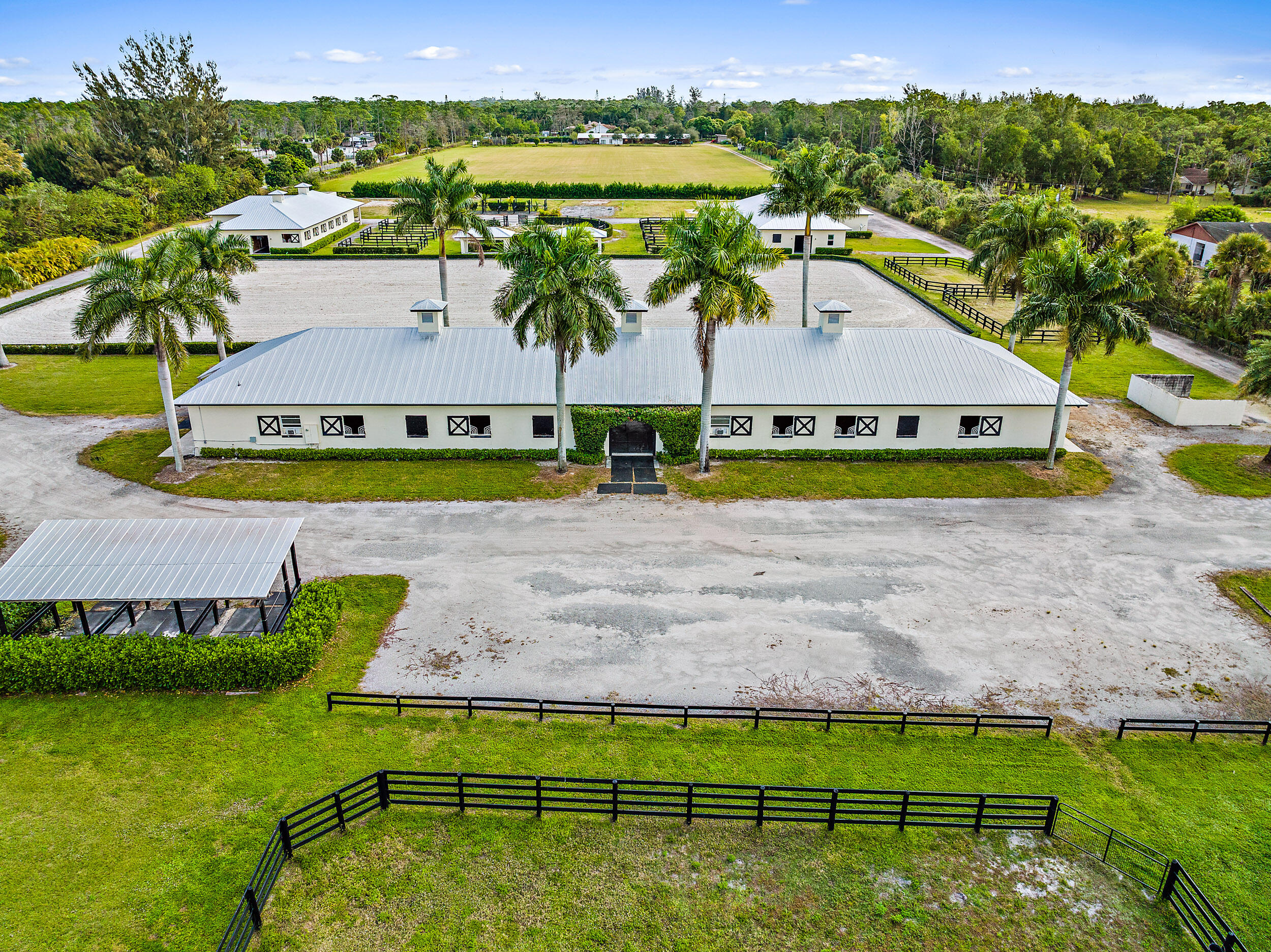1150 F Road Loxahatchee Groves, FL 33470 - Photo 26 of 33 an aerial view of a house with a swimming pool