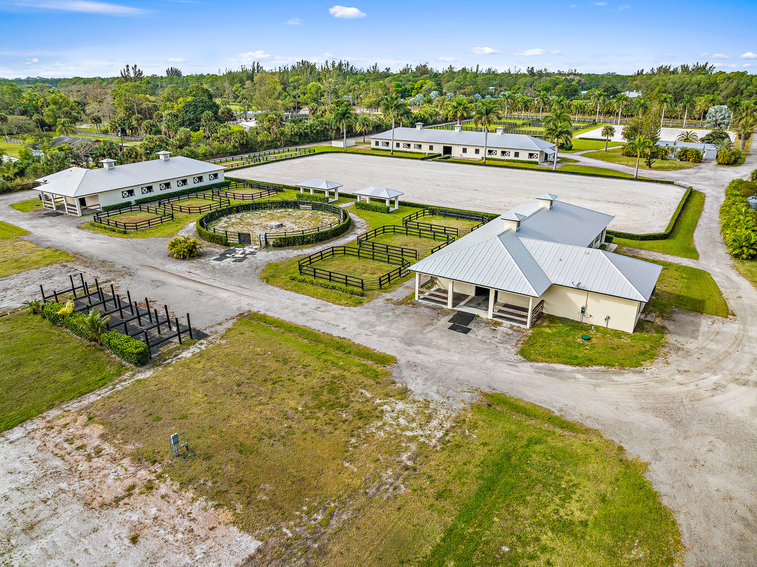 1150 F Road Loxahatchee Groves, FL 33470 - Photo 28 of 33 an aerial view of a house with a swimming pool