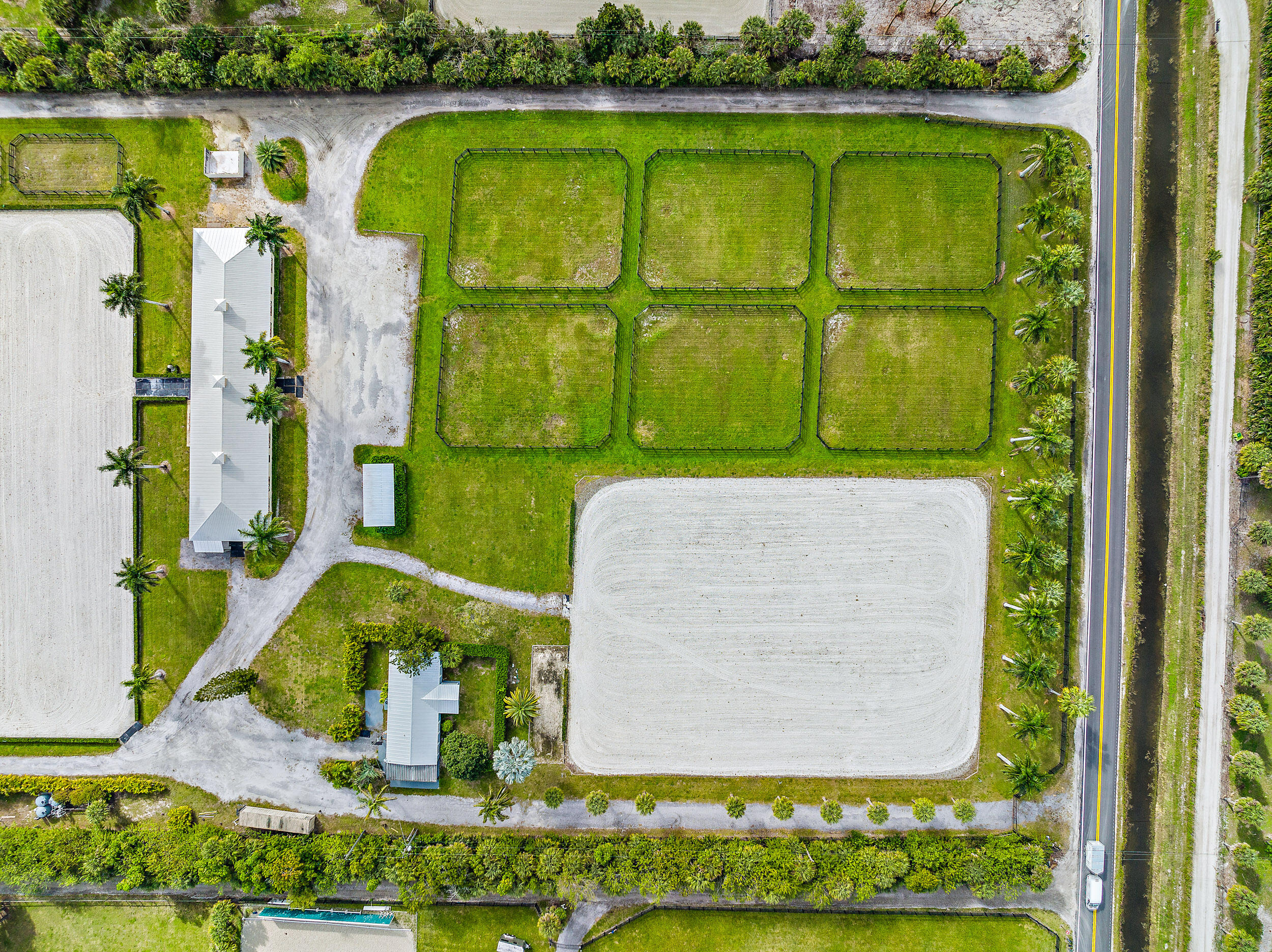 1150 F Road Loxahatchee Groves, FL 33470 - Photo 32 of 33 a view of swimming pool with a garden and plants