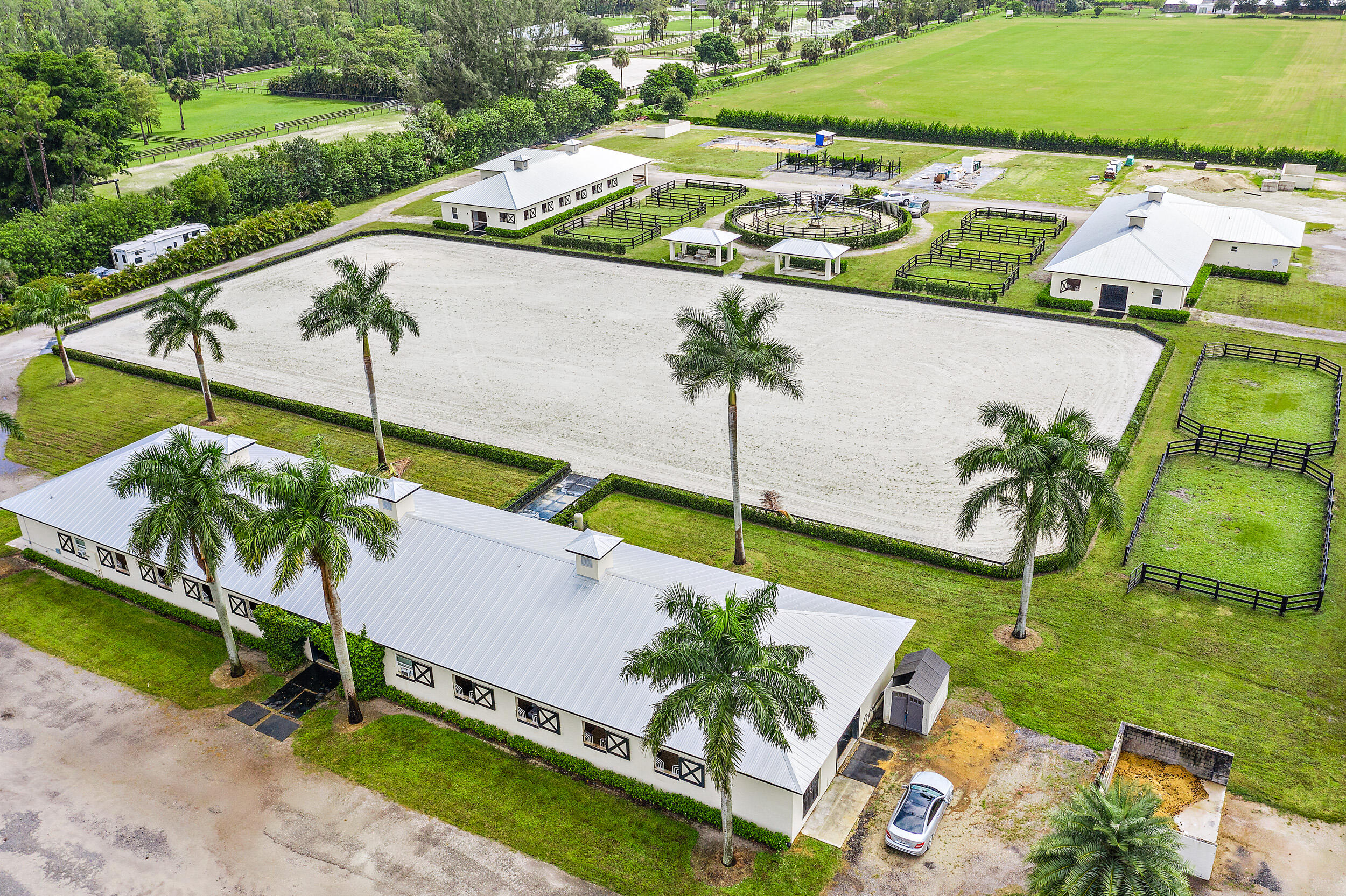 1150 F Road Loxahatchee Groves, FL 33470 - Photo 9 of 33 an aerial view of a house with a garden and swimming pool