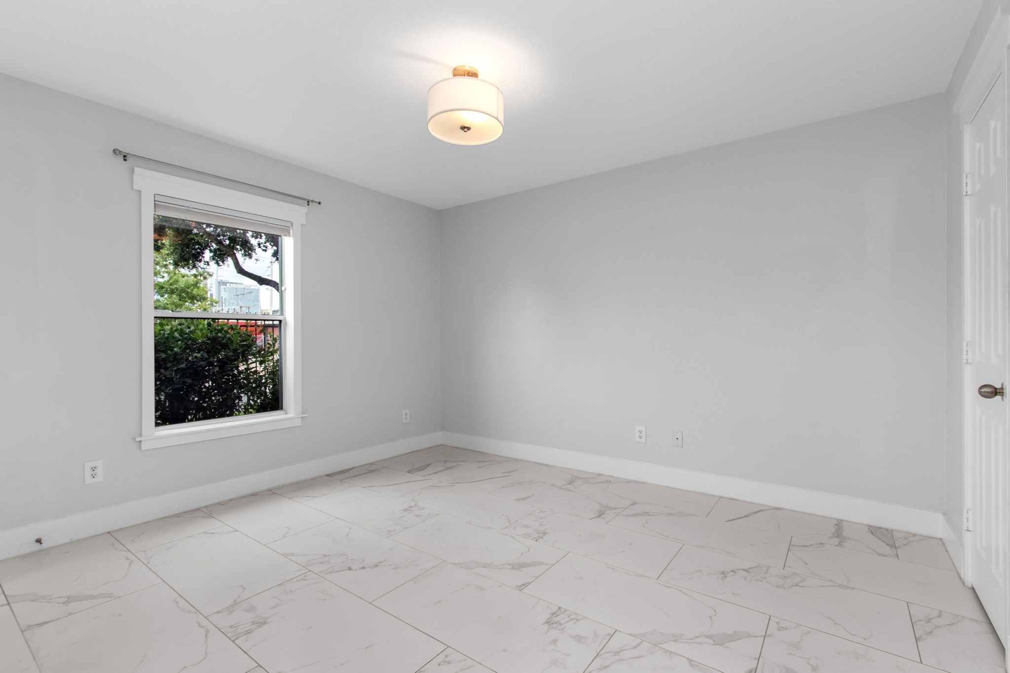 1213 Nagle Street Houston, TX 77003 - Photo 13 of 25 an empty room with a window