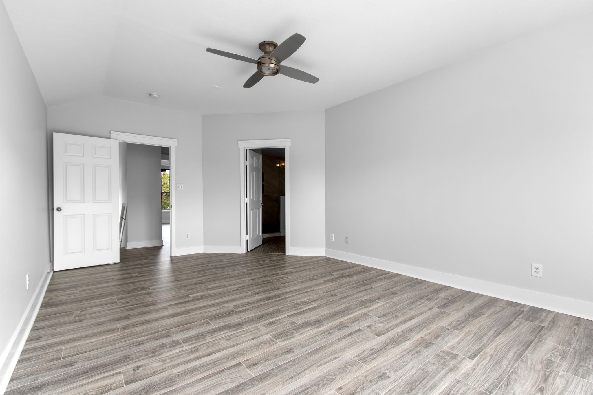 1213 Nagle Street Houston, TX 77003 - Photo 17 of 25 a view of empty room with wooden floor and ceiling fan