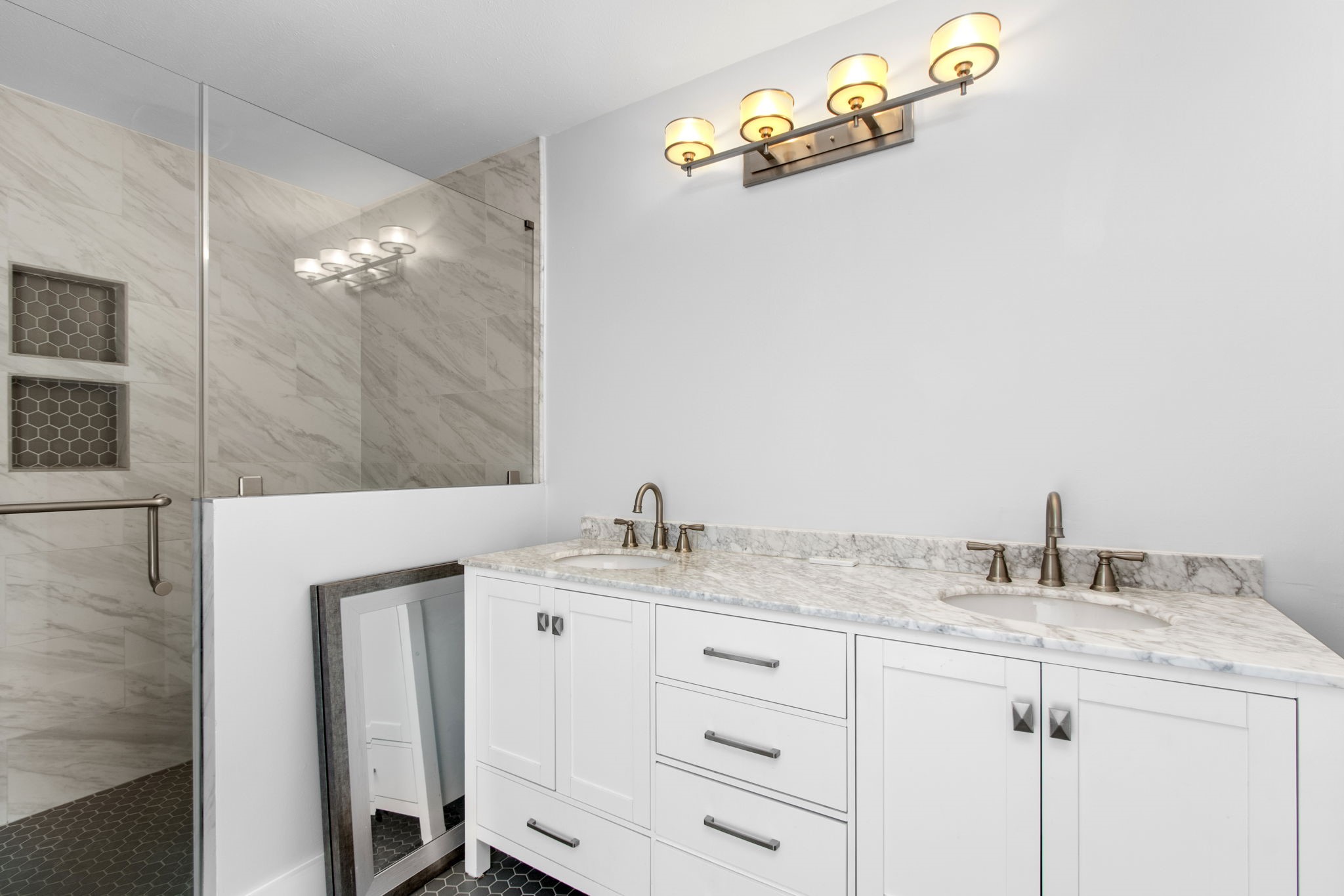 1213 Nagle Street Houston, TX 77003 - Photo 18 of 25 a bathroom with a granite countertop sink and a mirror