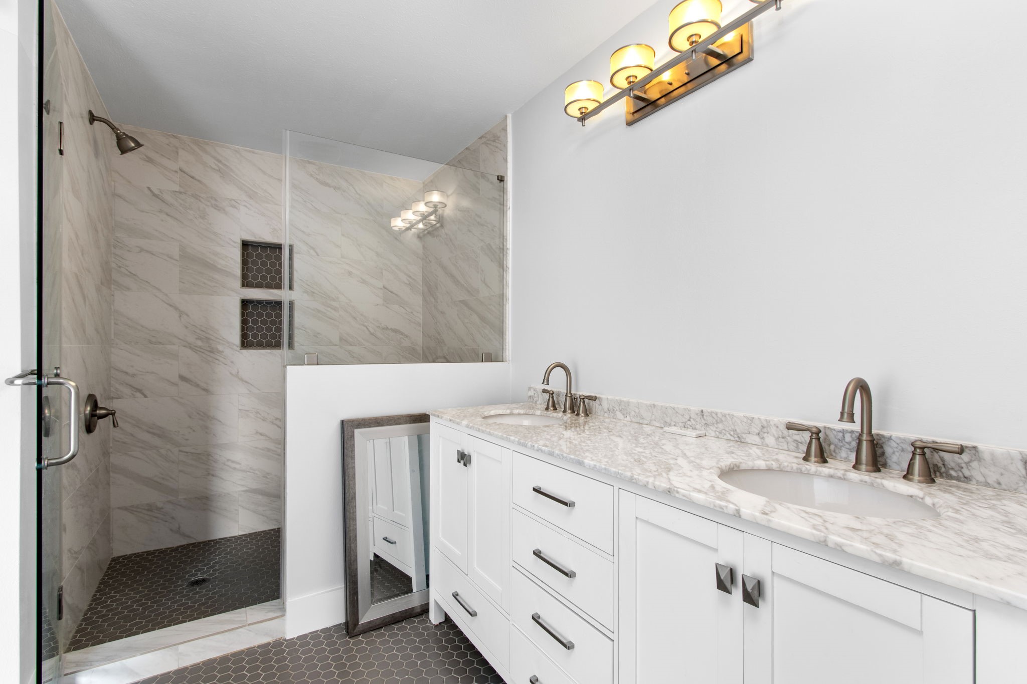 1213 Nagle Street Houston, TX 77003 - Photo 19 of 25 a bathroom with a granite countertop sink and a mirror