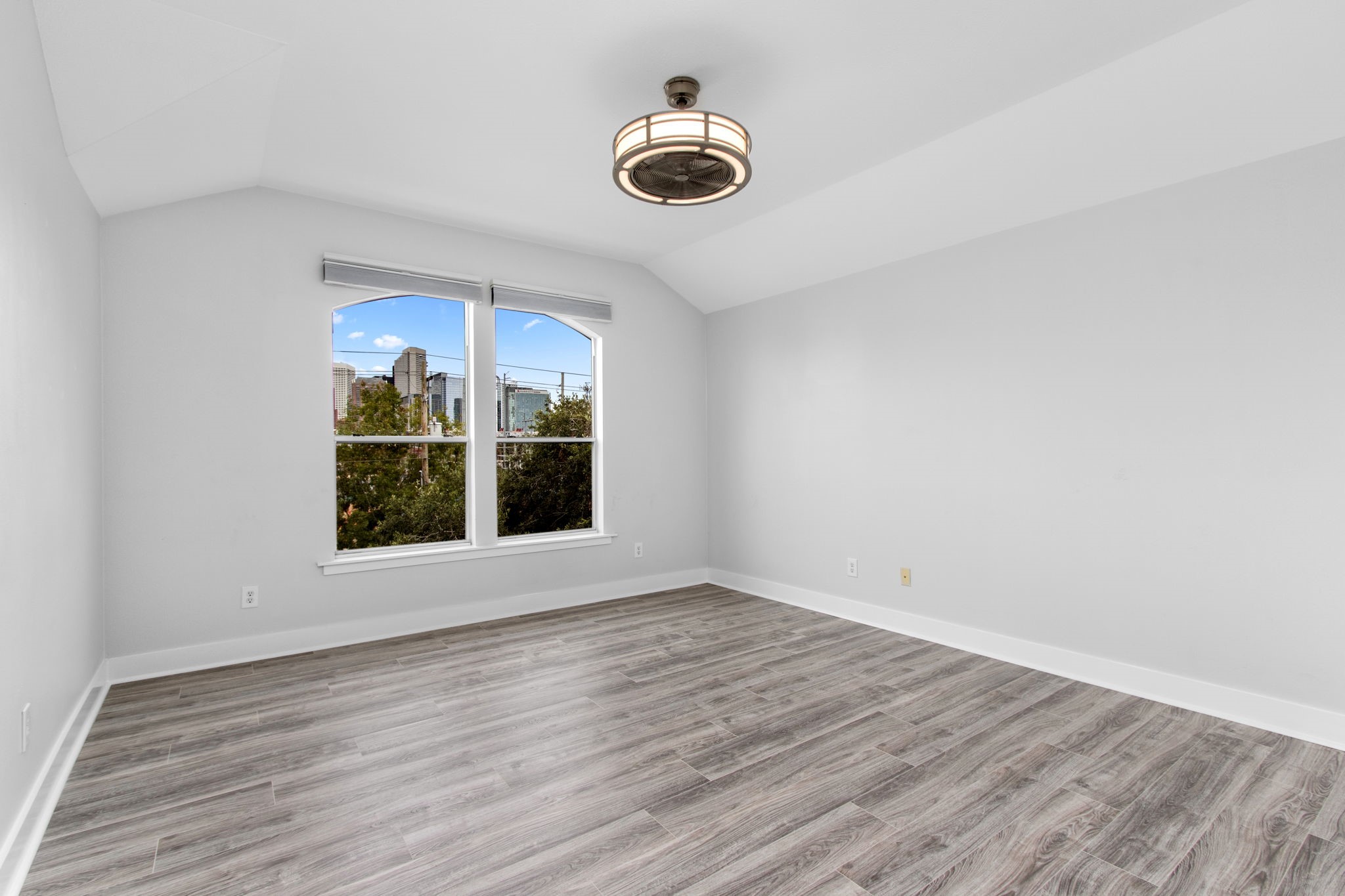 1213 Nagle Street Houston, TX 77003 - Photo 21 of 25 wooden floor in an empty room with a window