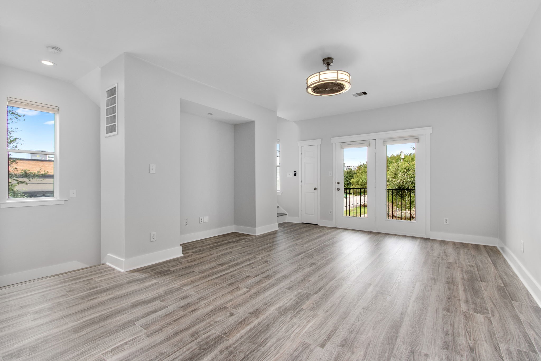 1213 Nagle Street Houston, TX 77003 - Photo 5 of 25 wooden floor in an empty room with a window