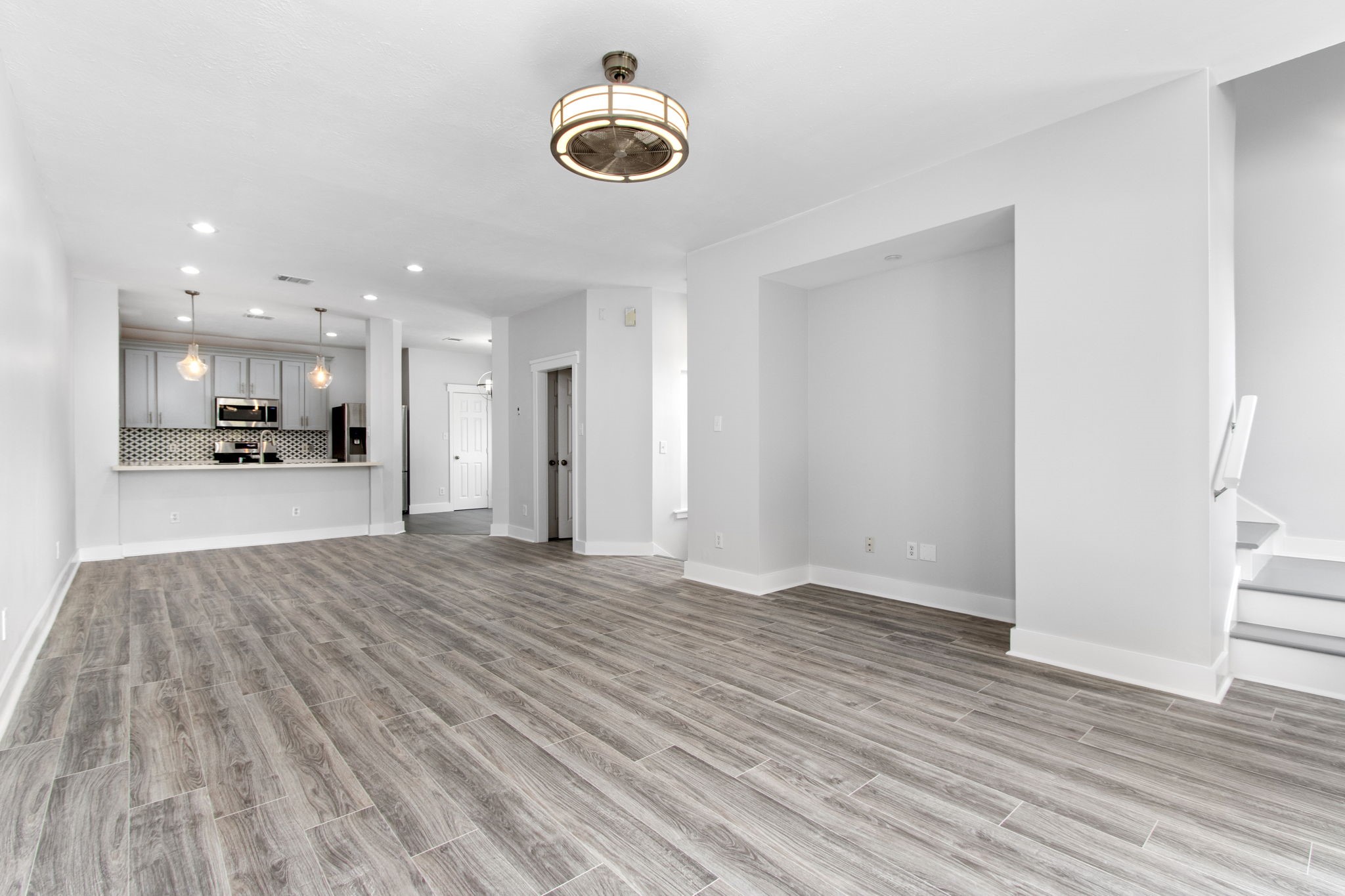 1213 Nagle Street Houston, TX 77003 - Photo 6 of 25 a view of an empty room and wooden floor