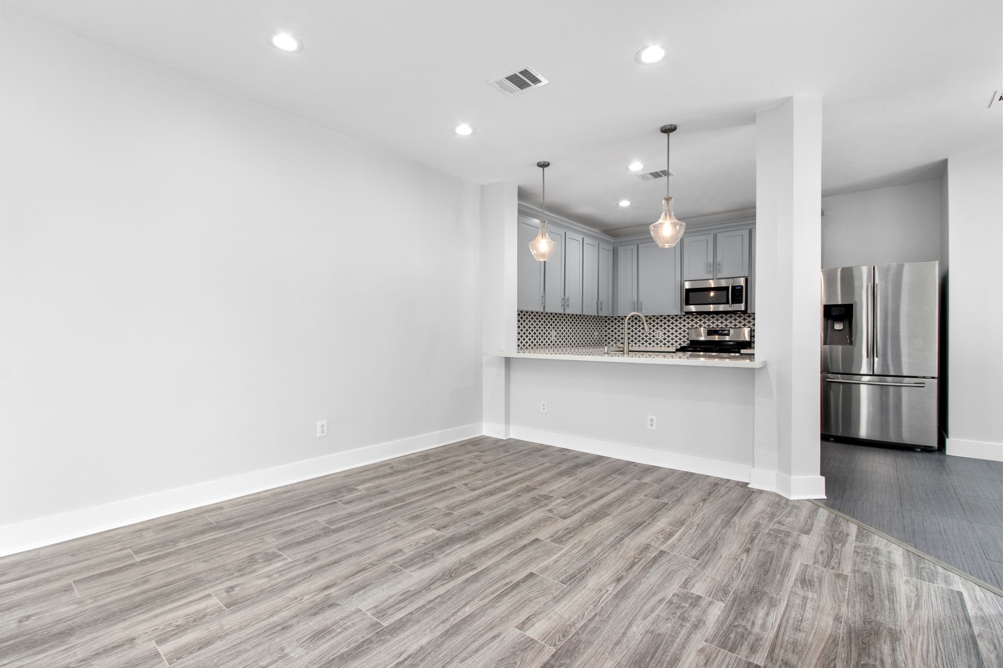 1213 Nagle Street Houston, TX 77003 - Photo 7 of 25 a view of kitchen with wooden floor