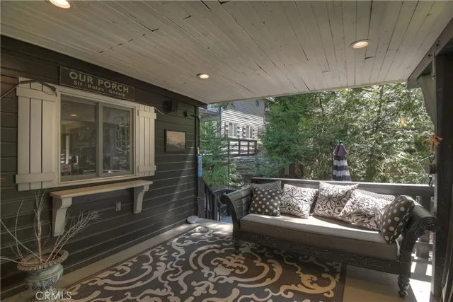 a outdoor living space with furniture and a potted plant