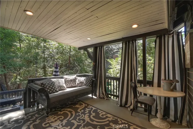 a outdoor living space with furniture and a potted plant