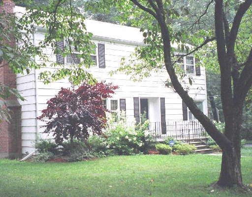 102 Larkspur Road Fairfield, CT 06824 - Photo 1 of 1 a front view of a house with garden