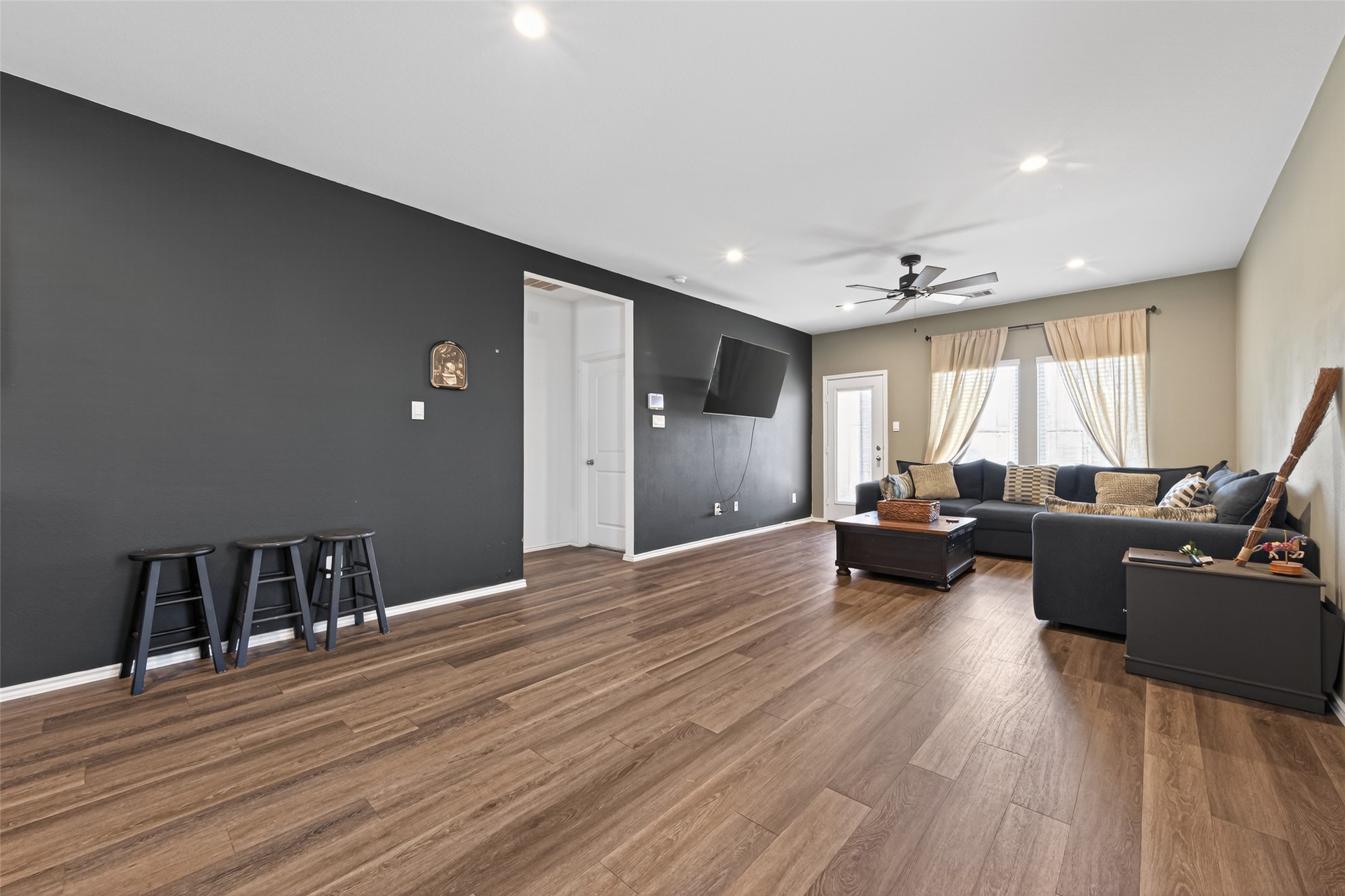 24251 Copperleaf Bay Ln Spring Spring, TX 77373 - Photo 11 of 42 a living room with furniture and a wooden floor