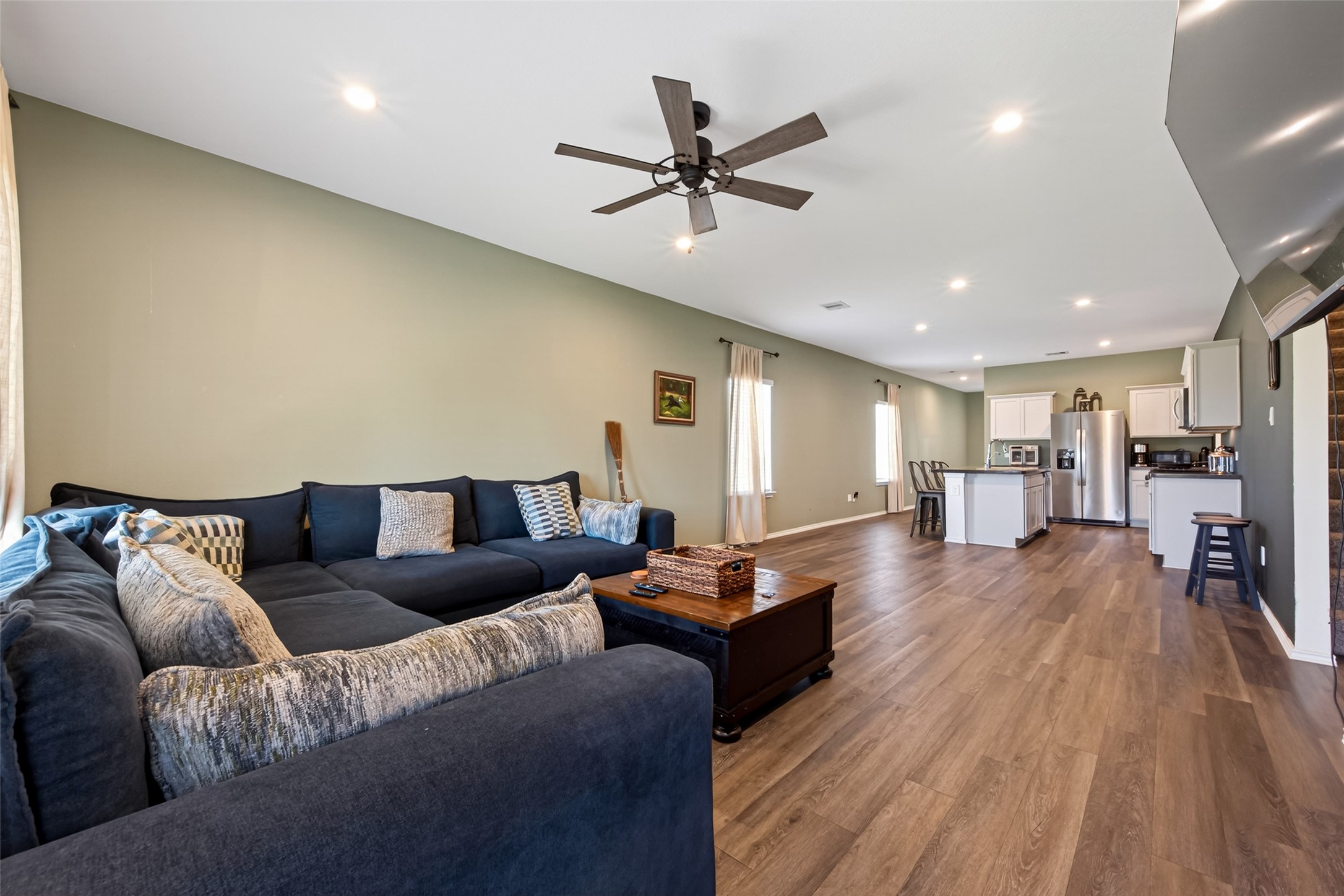 24251 Copperleaf Bay Ln Spring Spring, TX 77373 - Photo 16 of 42 a living room with furniture and a wooden floor