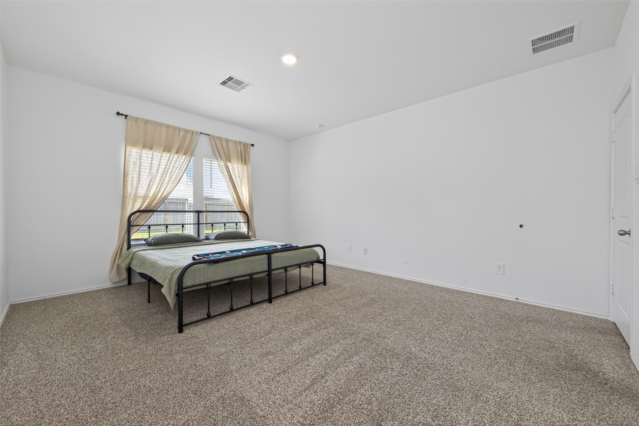 24251 Copperleaf Bay Ln Spring Spring, TX 77373 - Photo 19 of 42 a room with a bed and window