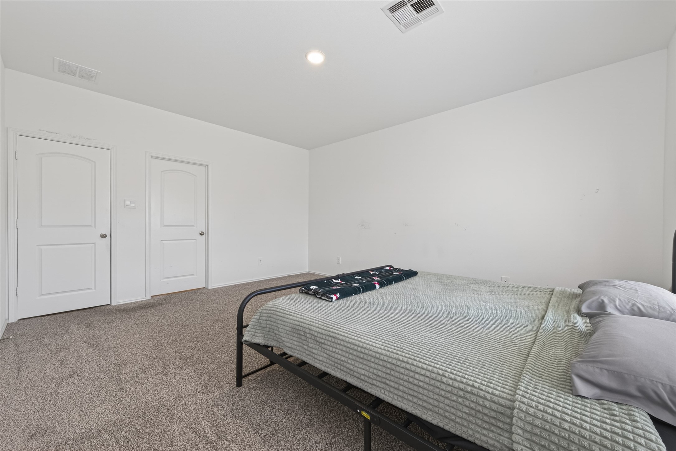 24251 Copperleaf Bay Ln Spring Spring, TX 77373 - Photo 20 of 42 a bedroom with a bed and with white cabinet