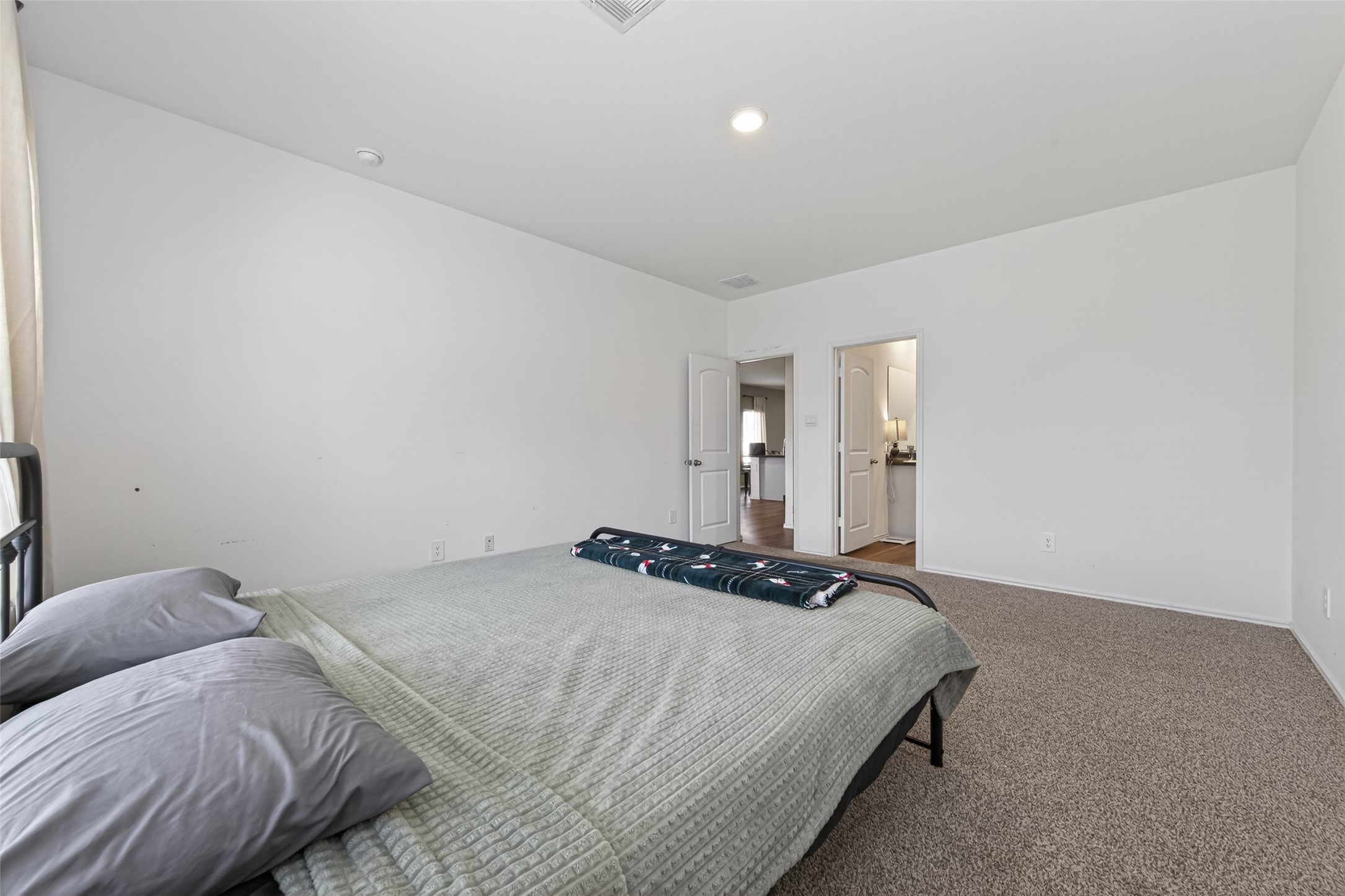 24251 Copperleaf Bay Ln Spring Spring, TX 77373 - Photo 21 of 42 a bedroom with a bed and lamp