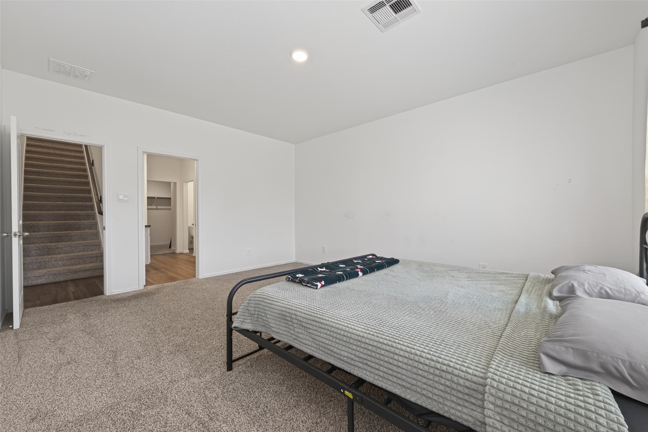 24251 Copperleaf Bay Ln Spring Spring, TX 77373 - Photo 22 of 42 a bedroom with a bed and dresser