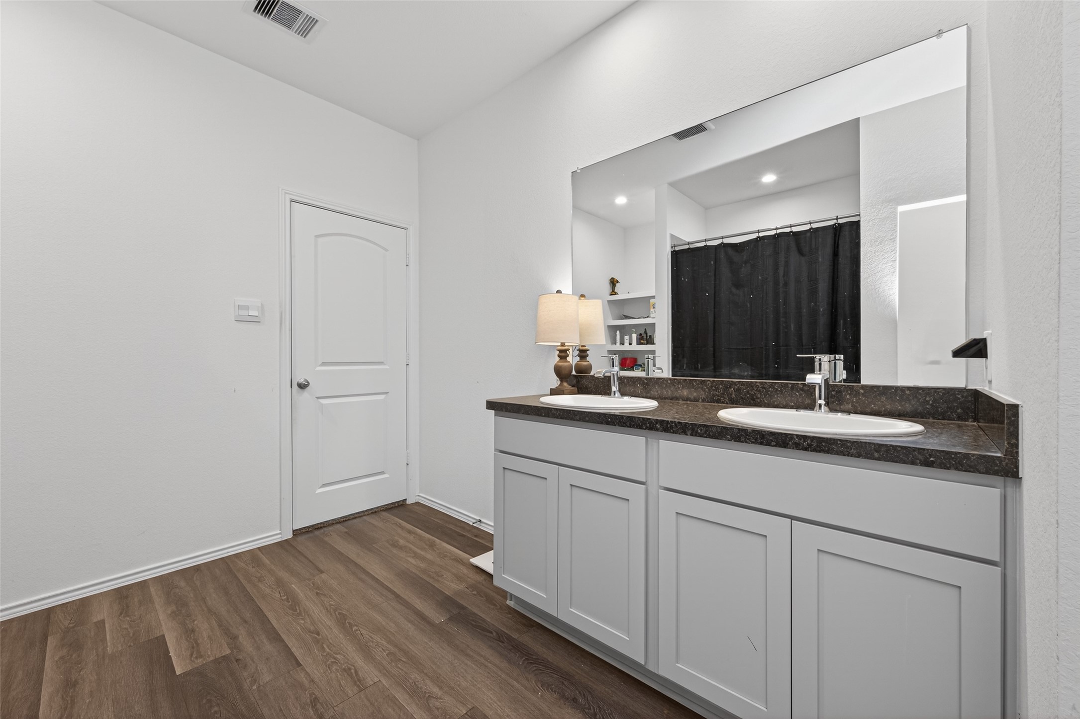 24251 Copperleaf Bay Ln Spring Spring, TX 77373 - Photo 24 of 42 a bathroom with a double vanity sink and mirror