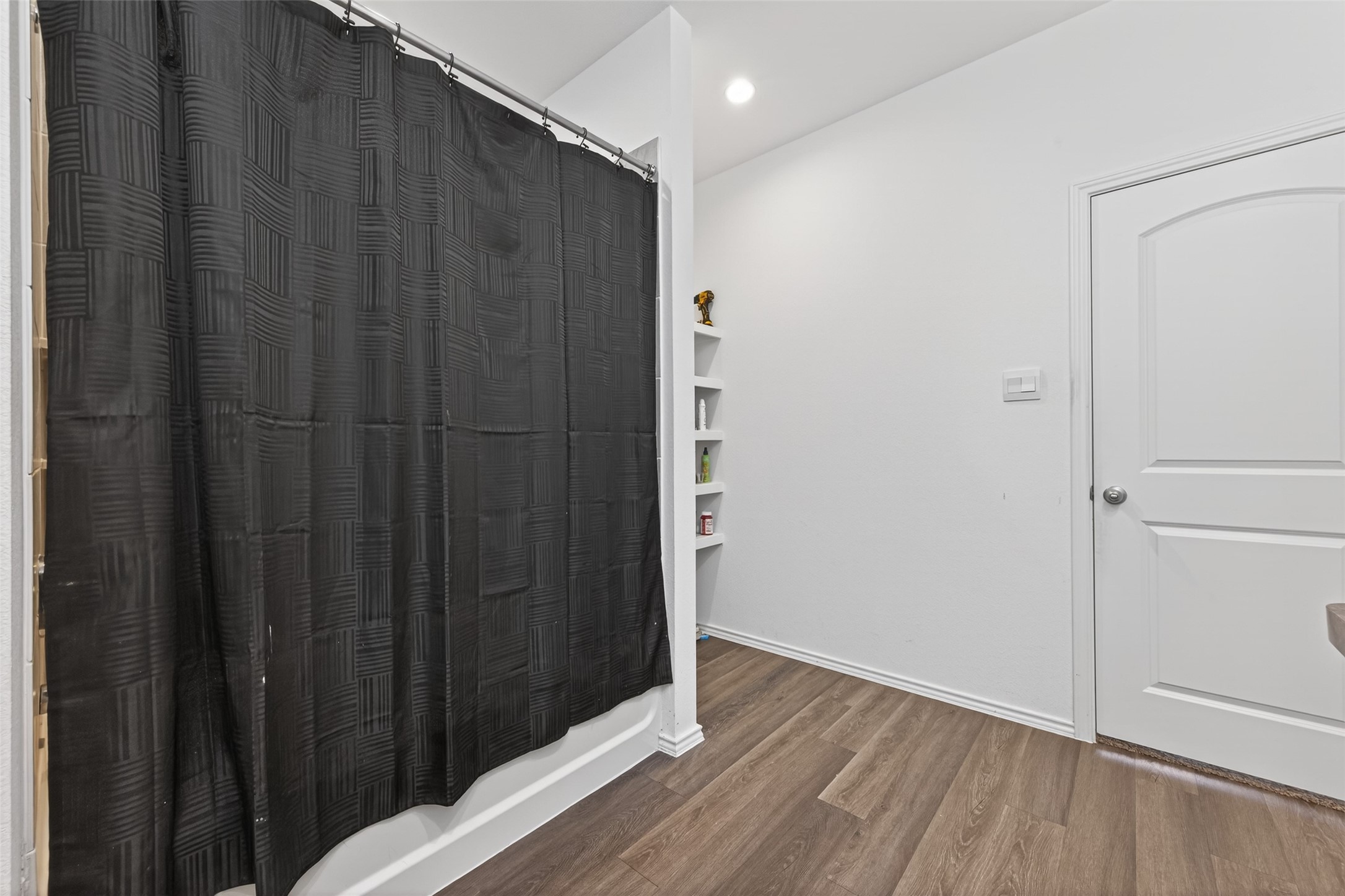 24251 Copperleaf Bay Ln Spring Spring, TX 77373 - Photo 25 of 42 a view of a hallway with wooden floor