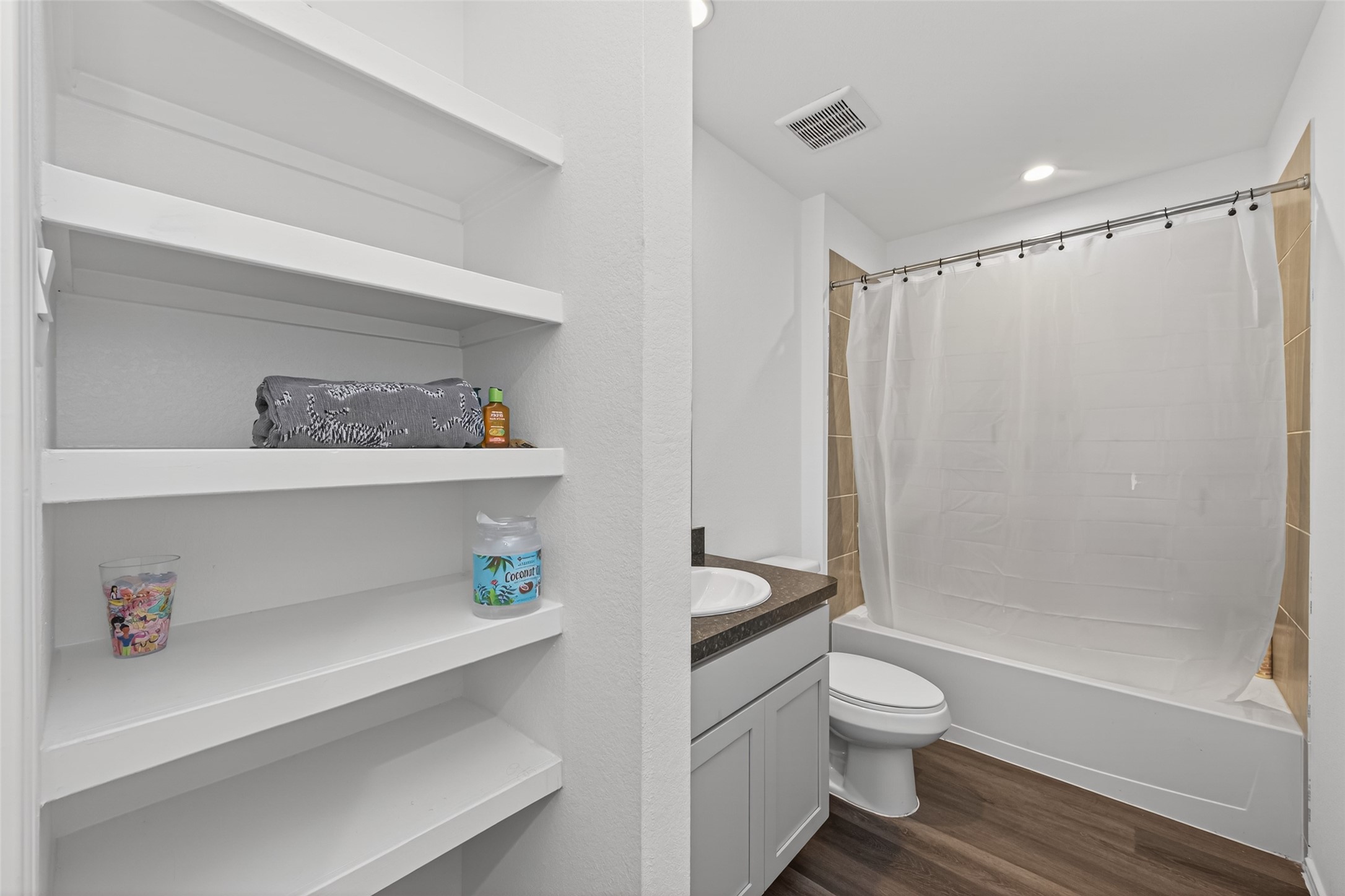 24251 Copperleaf Bay Ln Spring Spring, TX 77373 - Photo 33 of 42 a bathroom with a sink a toilet and a shower