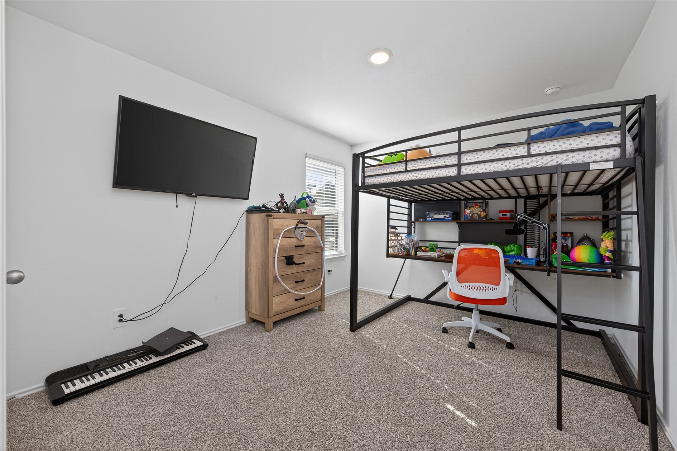 24251 Copperleaf Bay Ln Spring Spring, TX 77373 - Photo 35 of 42 a room with gym equipment and a flat screen tv