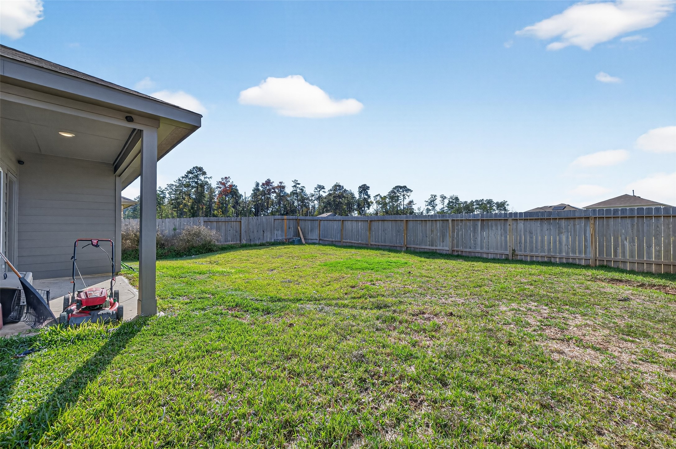 24251 Copperleaf Bay Ln Spring Spring, TX 77373 - Photo 38 of 42 a view of yard with swimming pool and outdoor seating