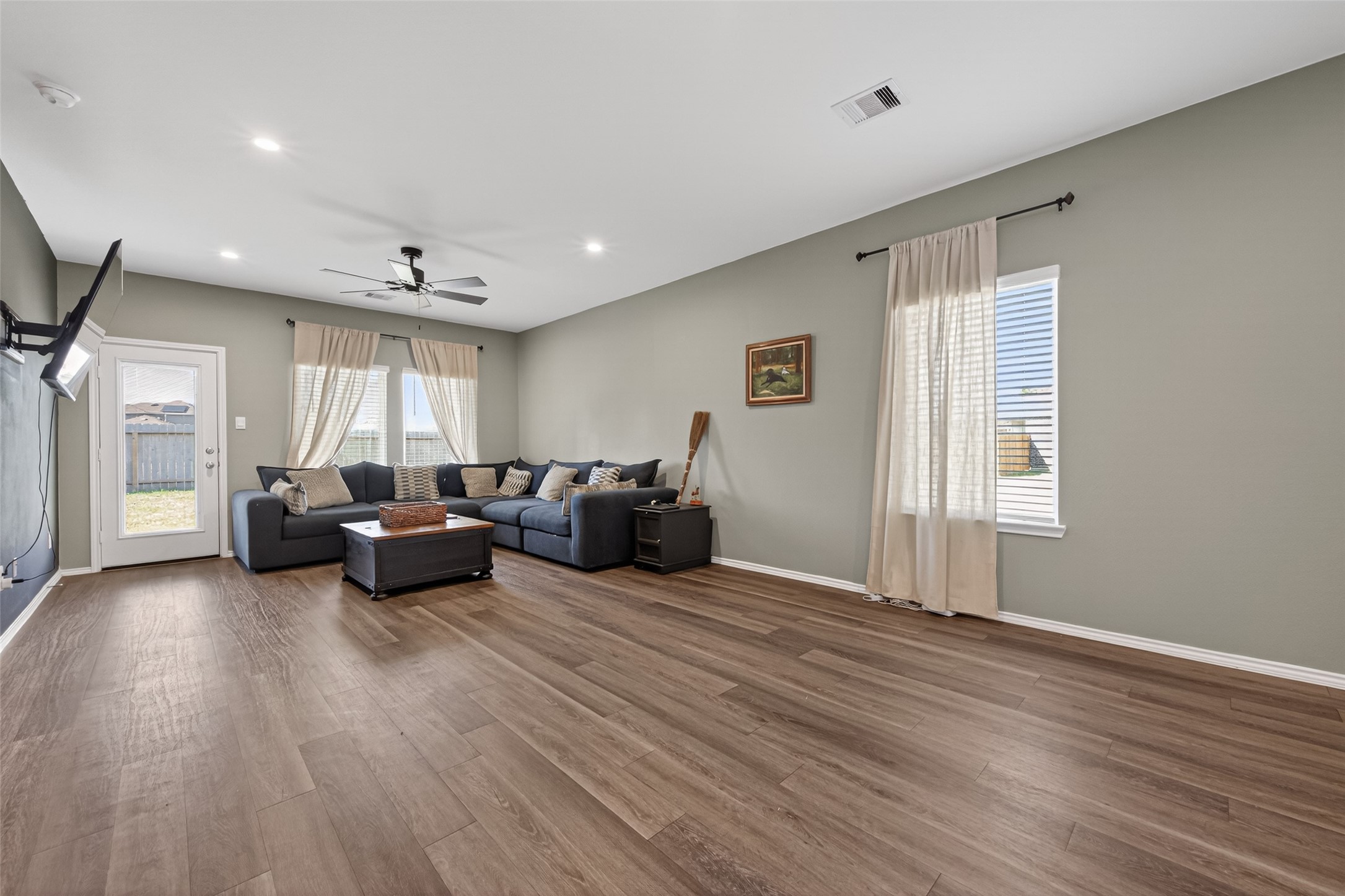 24251 Copperleaf Bay Ln Spring Spring, TX 77373 - Photo 10 of 42 a living room with furniture and a wooden floor