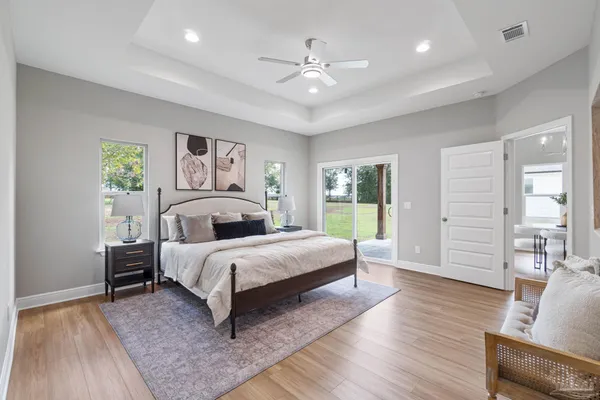 a bed room with a bed and a chandelier