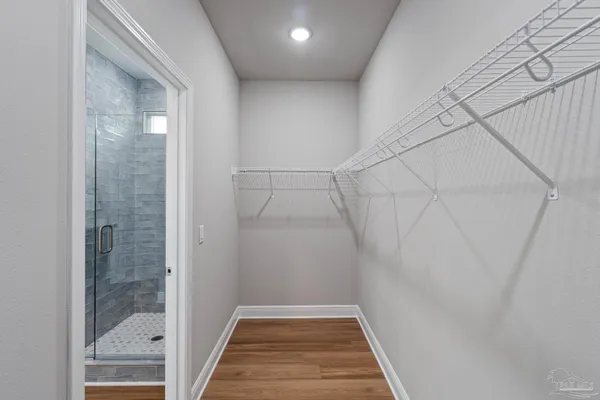 a bathroom with a toilet and a view of bathroom