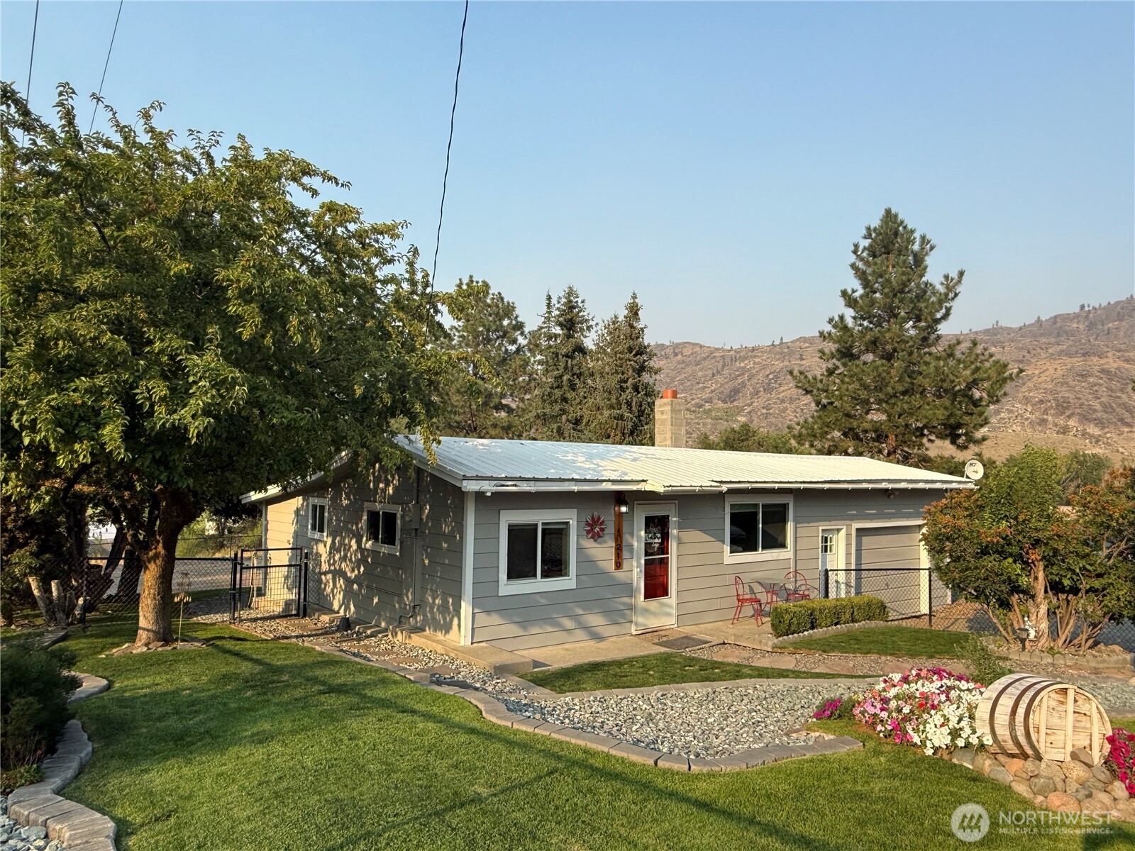 a front view of a house with a garden
