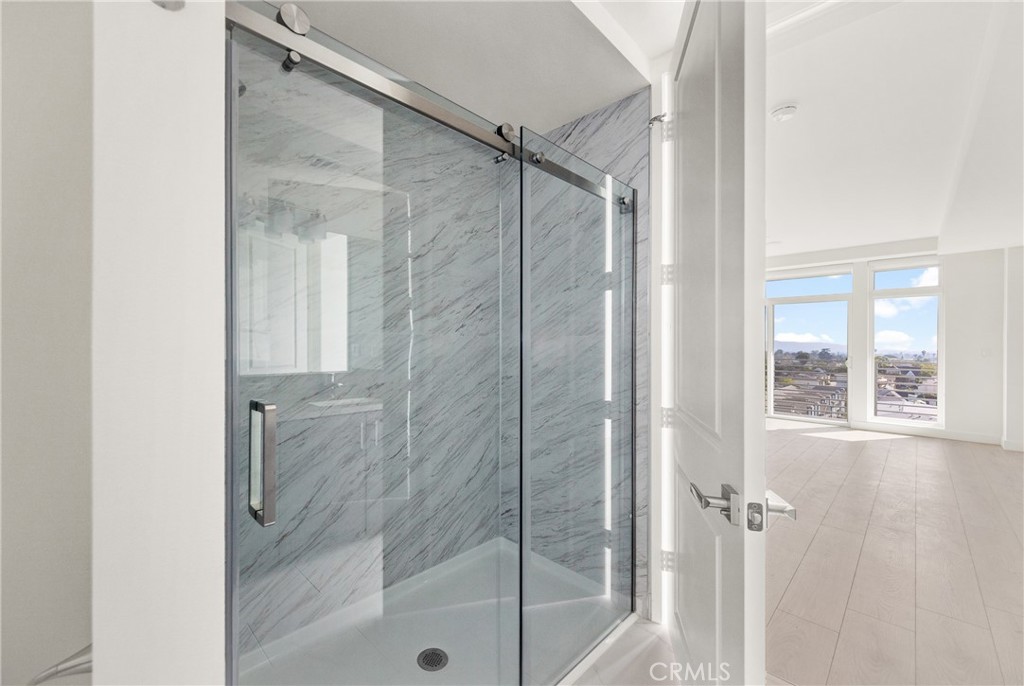 168 South Monterey Street, Unit 518 Alhambra, CA 91801 - Photo 12 of 45 a bathroom with a glass shower door