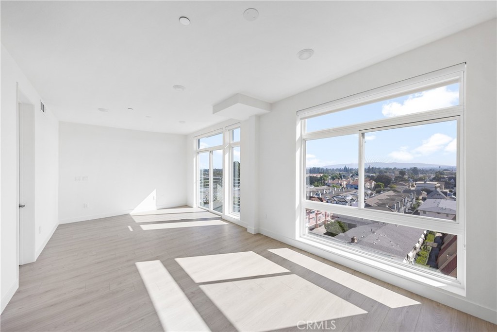 168 South Monterey Street, Unit 518 Alhambra, CA 91801 - Photo 19 of 45 a living room with a large window and a rug