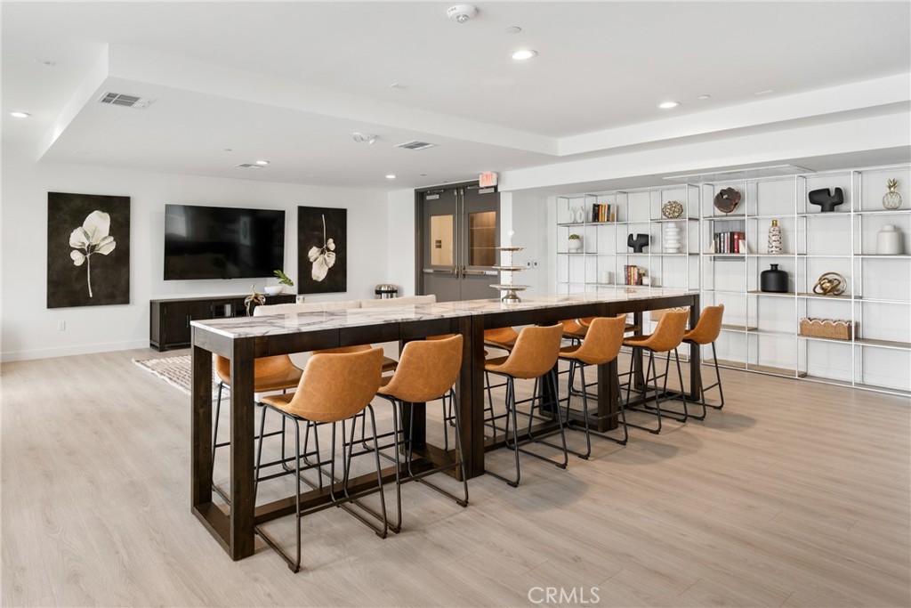 168 South Monterey Street, Unit 518 Alhambra, CA 91801 - Photo 28 of 45 a large kitchen with a table and chairs in it