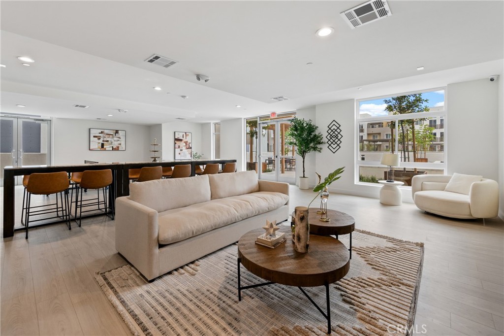 168 South Monterey Street, Unit 518 Alhambra, CA 91801 - Photo 30 of 45 a living room with furniture and a large window