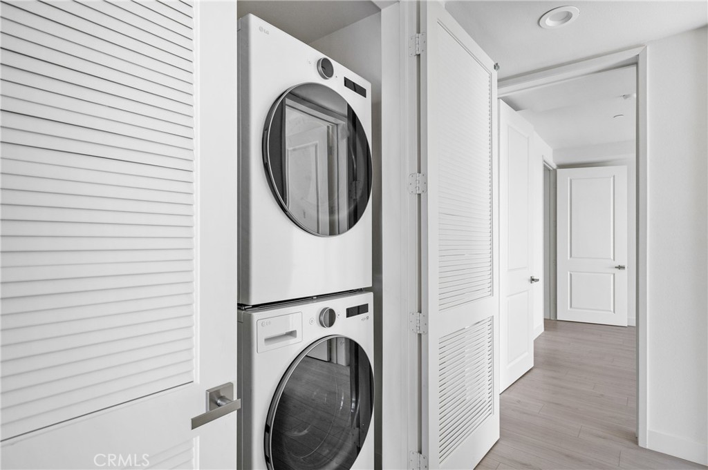 168 South Monterey Street, Unit 518 Alhambra, CA 91801 - Photo 6 of 45 a view of a hallway with washer and dryer