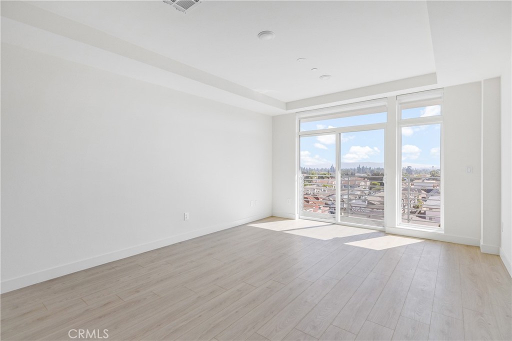 168 South Monterey Street, Unit 518 Alhambra, CA 91801 - Photo 9 of 45 wooden floor in an empty room with a window