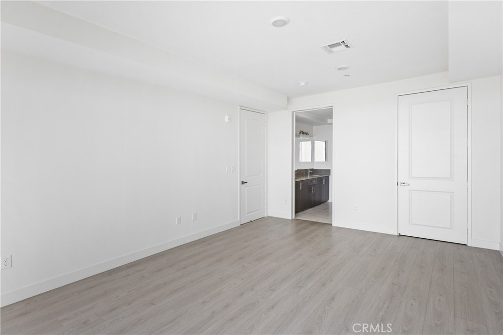 168 South Monterey Street, Unit 518 Alhambra, CA 91801 - Photo 10 of 45 a view of empty room with wooden floor