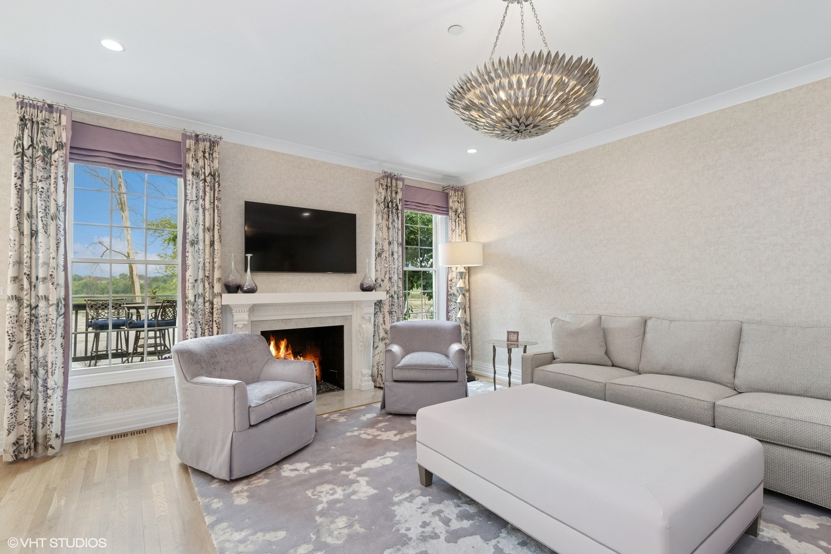 37 Harborside Way Hawthorn Woods, IL 60047 - Photo 10 of 28 a living room with furniture a flat screen tv and a fireplace